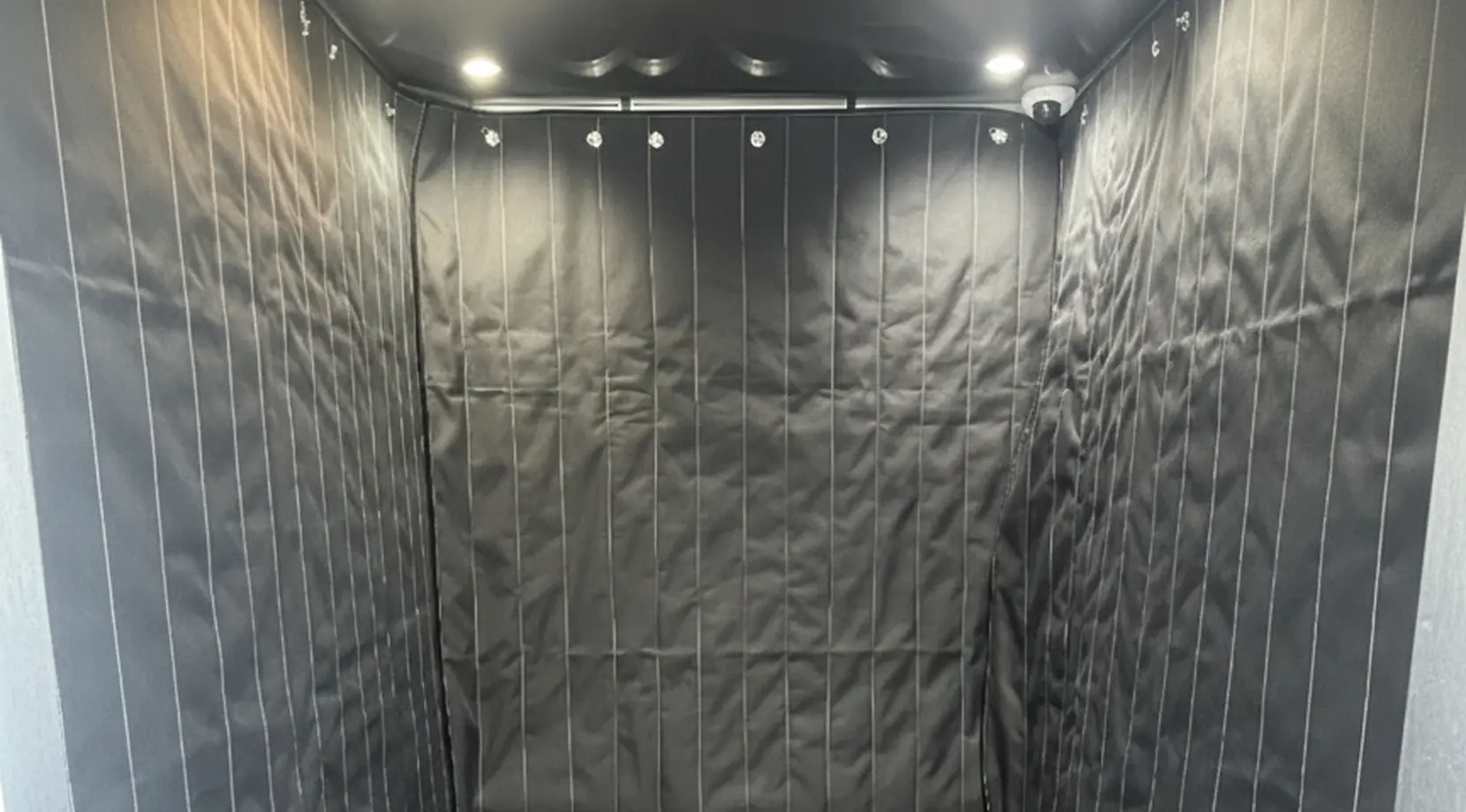 Empty padded freight elevator, highlighting how long does it take to move a studio apartment in an apartment building.