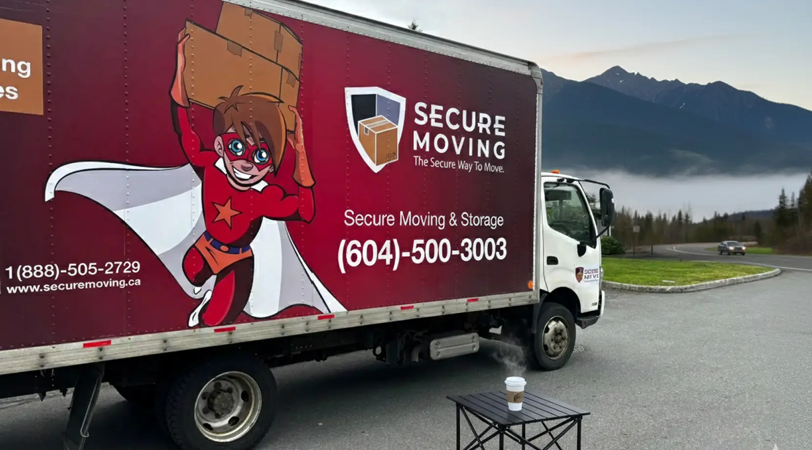 Vancouver to Toronto movers on the road: Secure Moving truck pauses by mountains, coffee steaming, long distance moving Vancouver to Toronto underway.